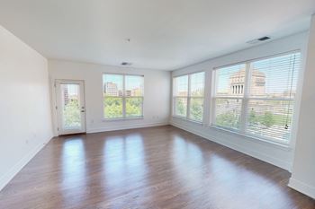 Large windows with ample natural lighting and stunning park and city views at The Whit Apartments in Indianapolis, IN 46204